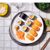 Суши и сашими - символы японской кухни, приготовленные из свежего норвежского лосося. (Фото предоставлено Норвежским советом по морепродуктам) 